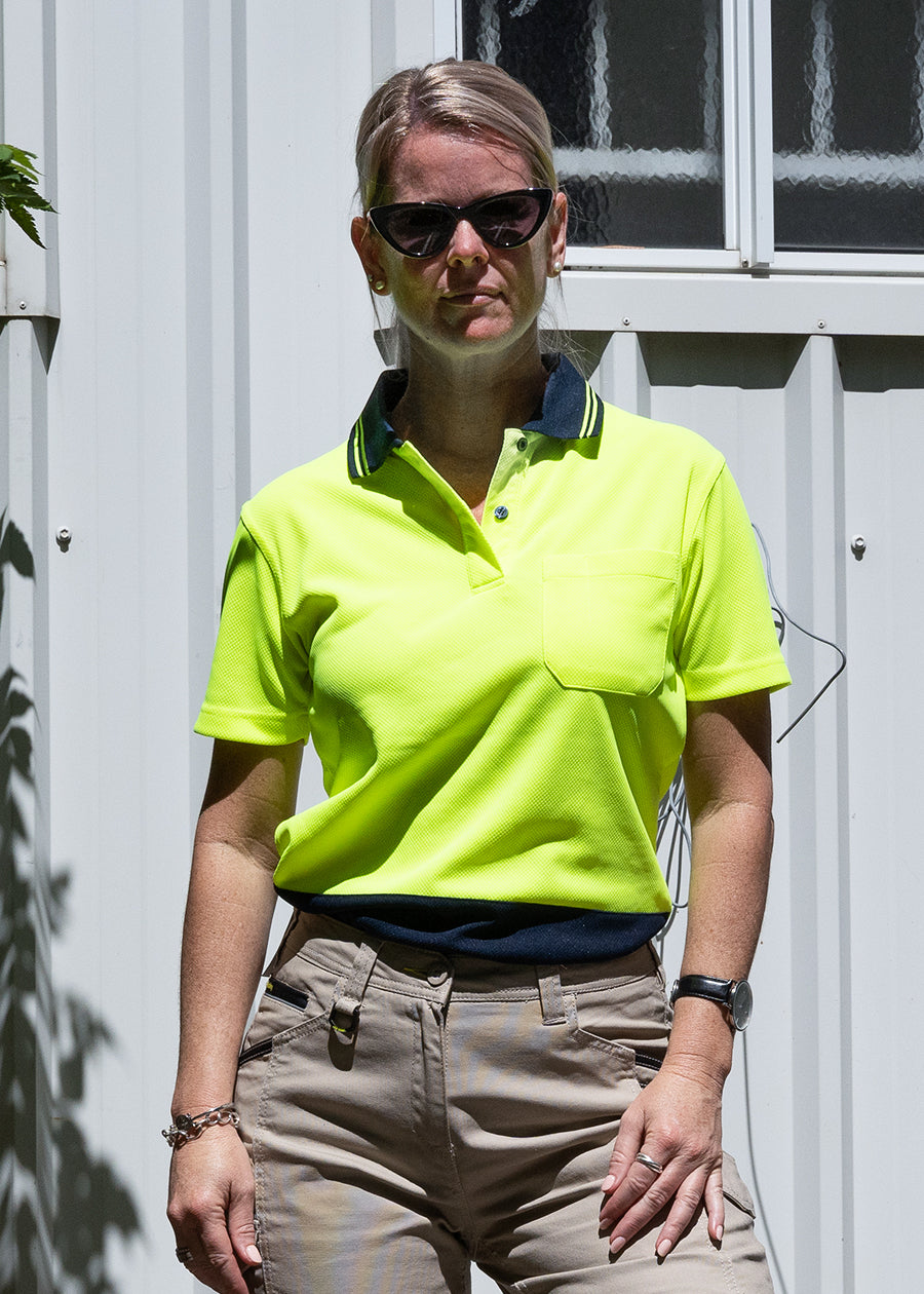 High visibility women's short sleeve polo with buttons.